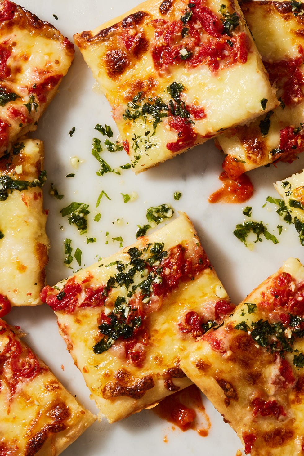 grandma pizza with basil sauce on top