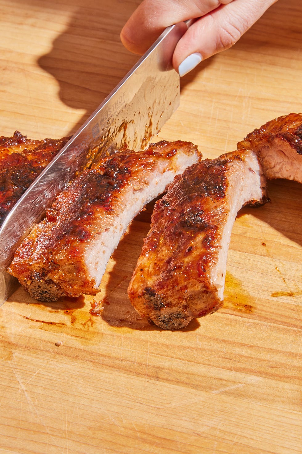 grilled ribs getting cut