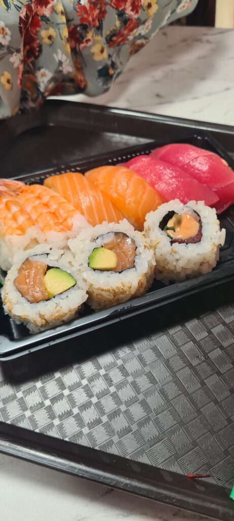 How many calories in this meal? Sushi, gyoza and chicken satay