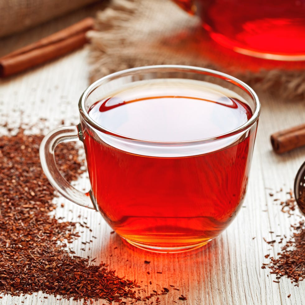 healthy traditional herbal rooibos beverage tea with spices on vintage