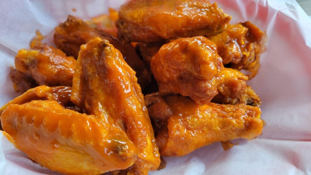 From the fryer - fresh, not frozen. Frank's Xtra hot and butter.