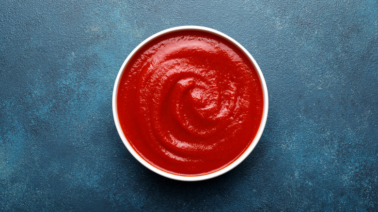 Overhead view of cup of ketchup