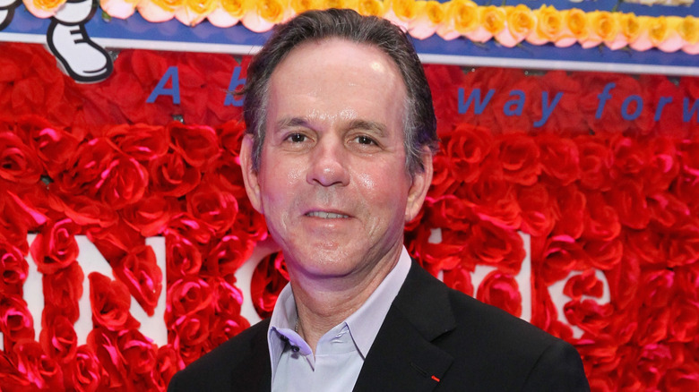 Thomas Keller smiles in collared shirt and blazer