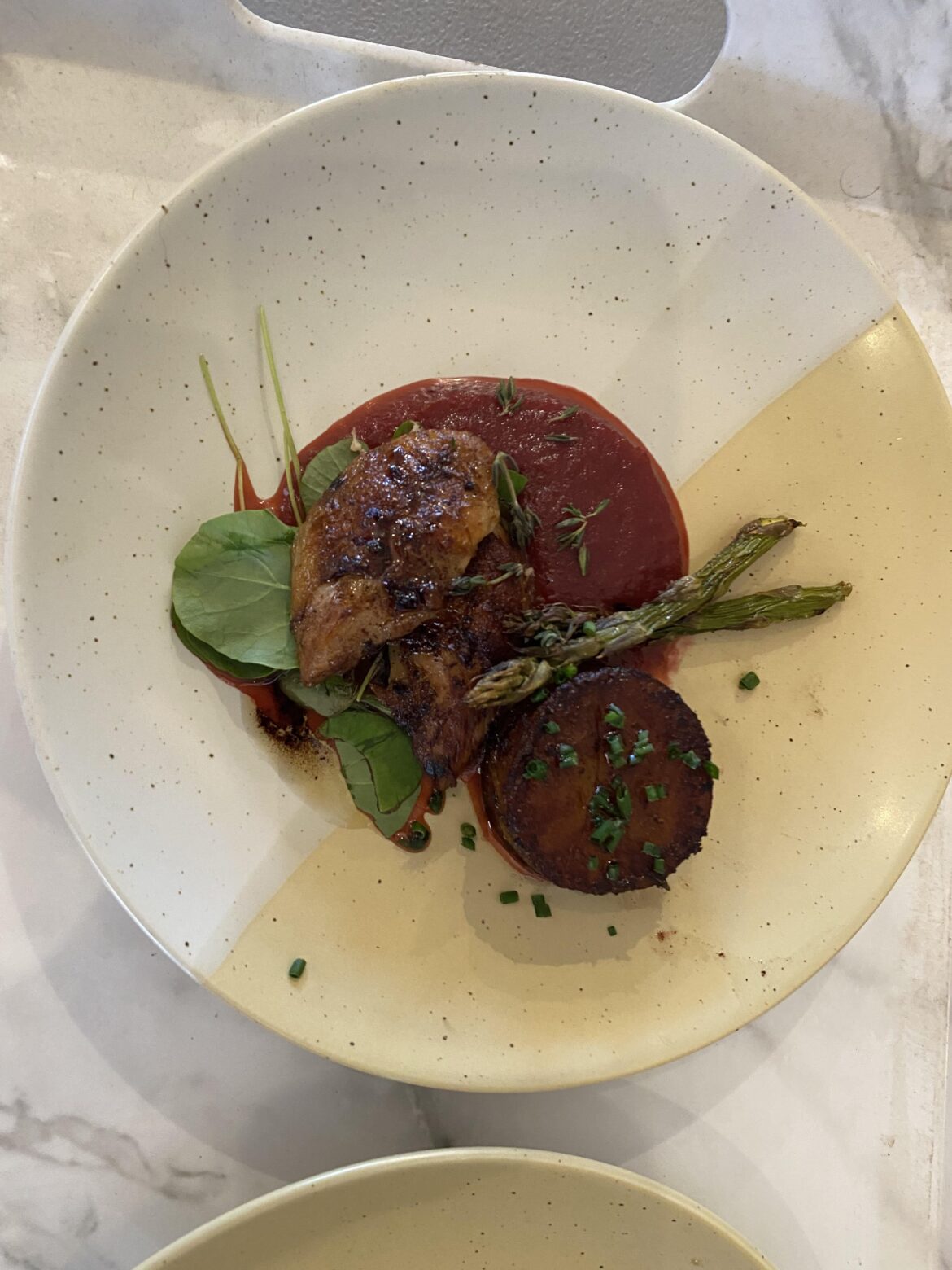 Seared quail breast, plum sauce, fondant potato, watercress with thyme and chives