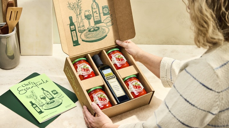 person looking at Corto x Stanislaus Chef's Essentials Kit box