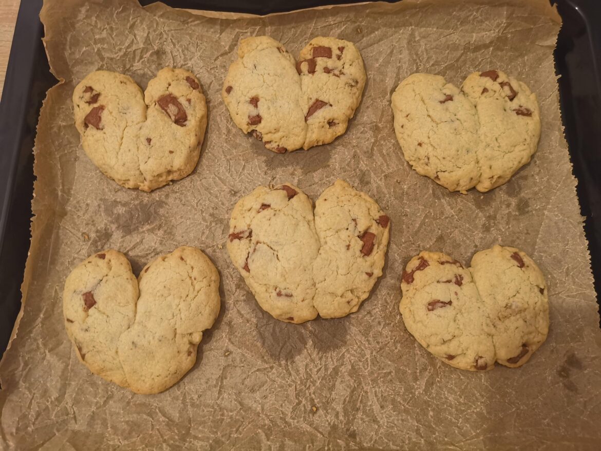 My Girlfriend is having a bad day so I baked some heart shaped choc chip cookies (or I tried least)