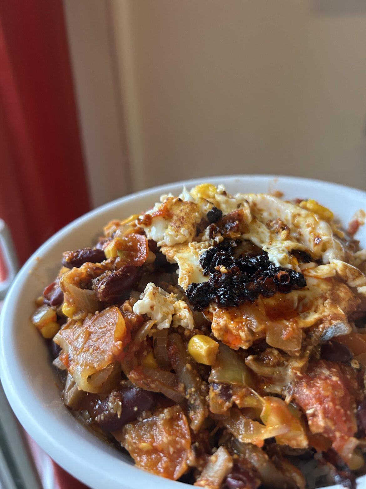 Veggie chili with a fucked up egg on top ❤️