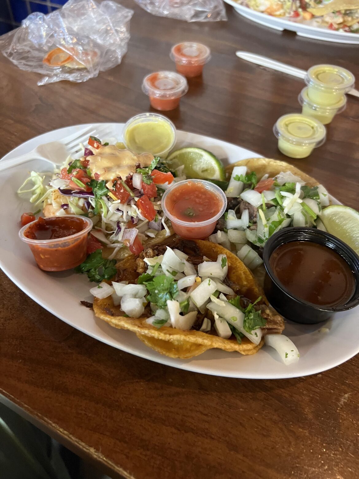 Cabeza, beef birria w/ consomé, and garlic shrimp on handmade tortillas from Los Tacos in Encinitas, CA