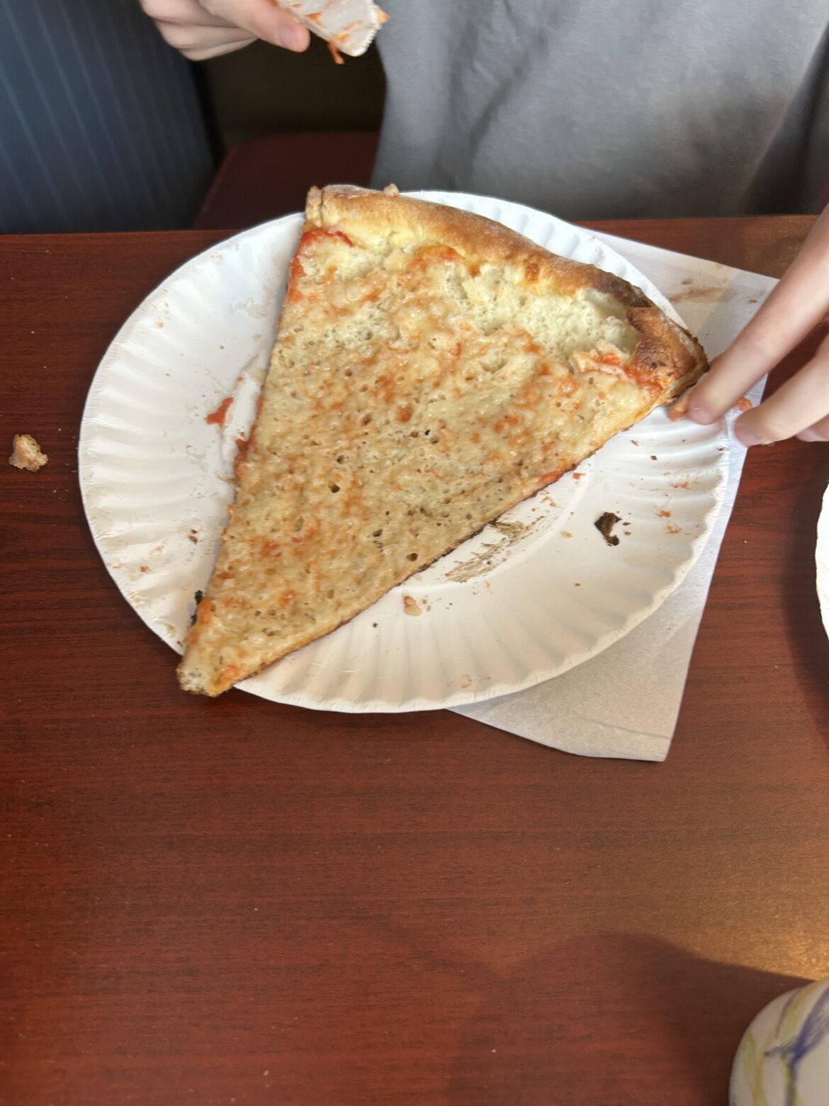 My brother scrapes his cheese off his pizza