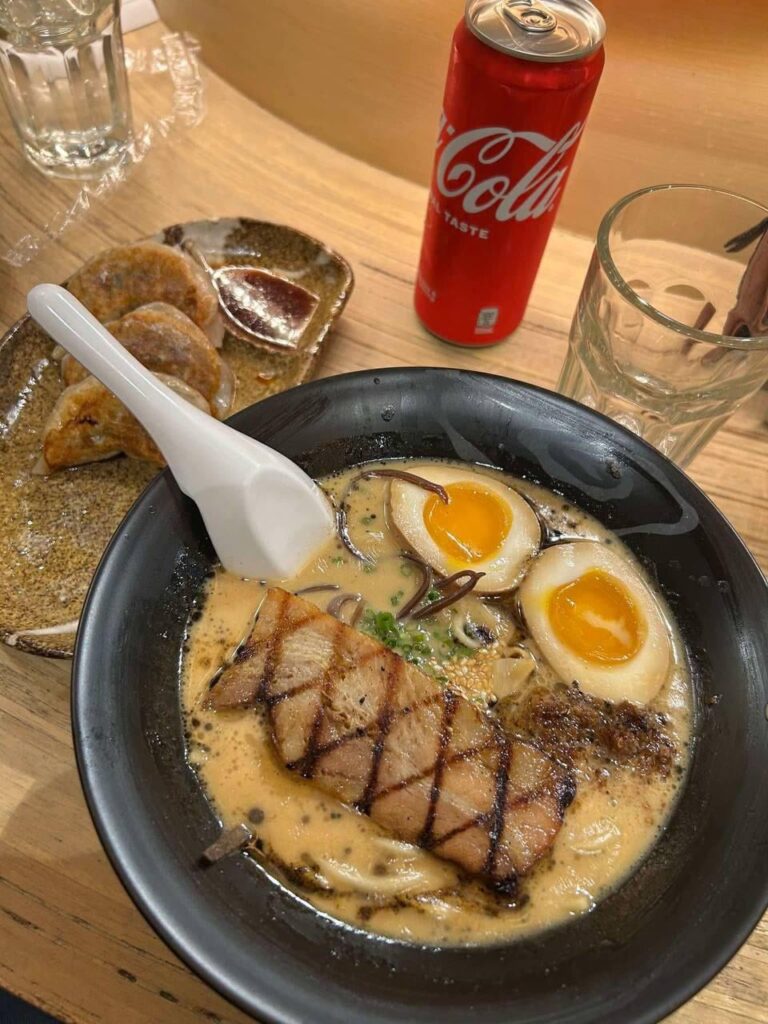 Shoyu ramen and fried gyoza with a soda on the side