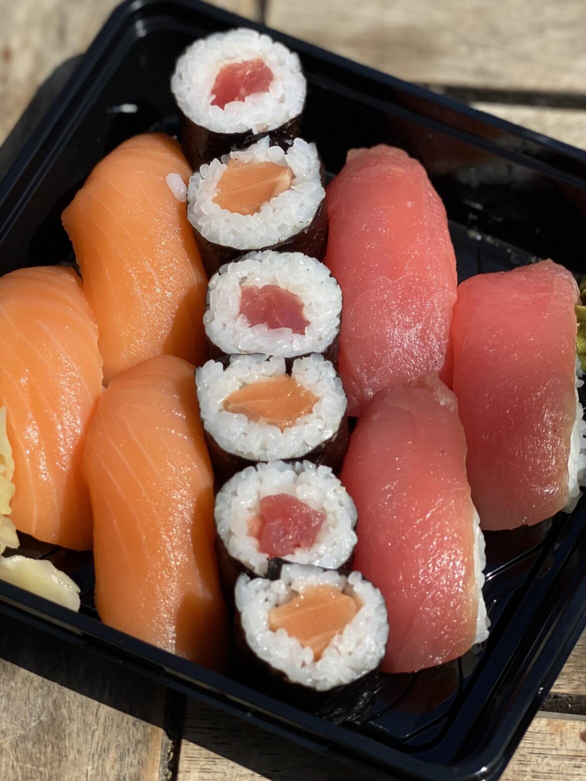 Salmon nigiri, salmon maki, tuna nigiri, and tuna maki