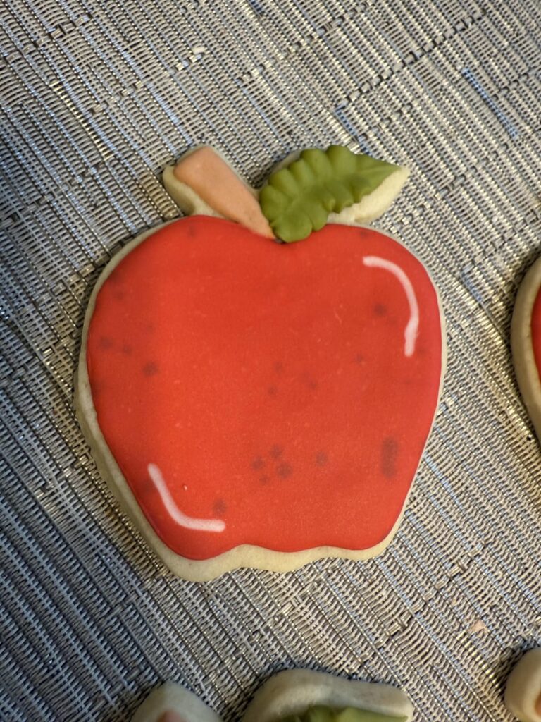 Black spots in red icing