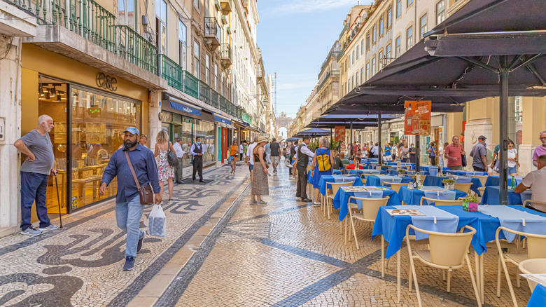 Outdoor dining on Rua Augusta in Lisbon, Portugal.