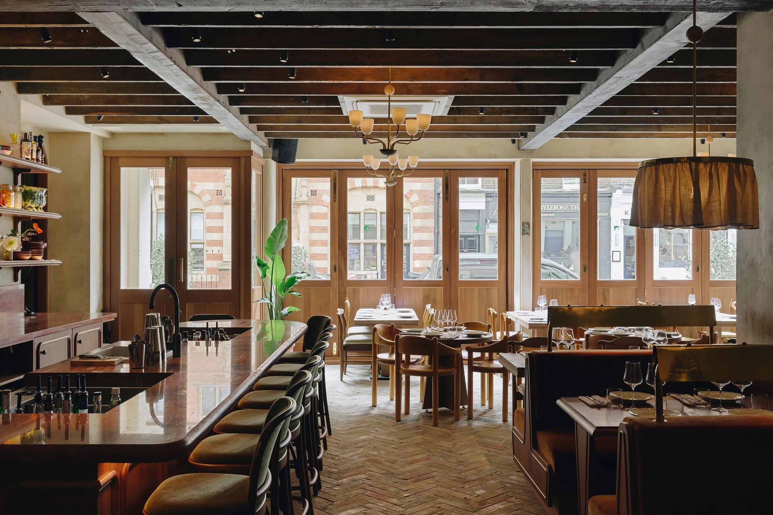 No waistcoats, no mirrored menus – just soft light, slick service and the smell of something very expensive on the grill