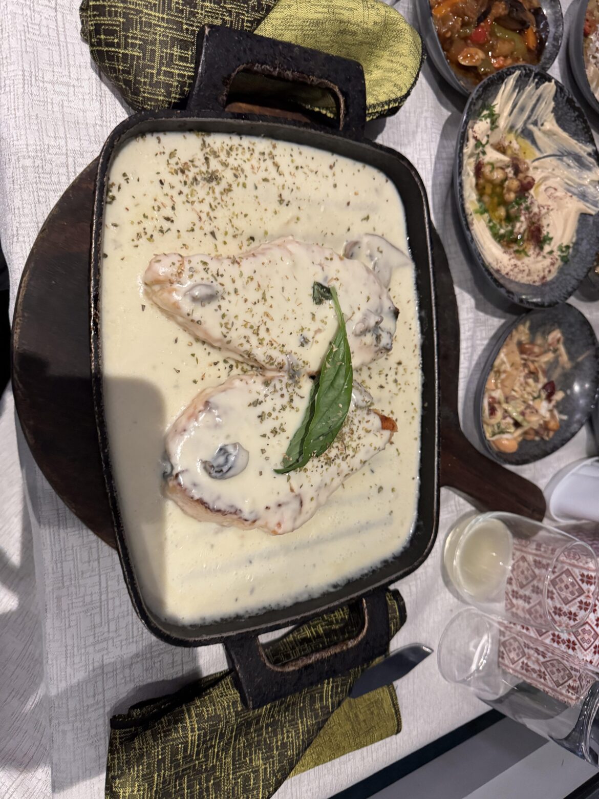 Salmon on cast iron on wooden cutting board