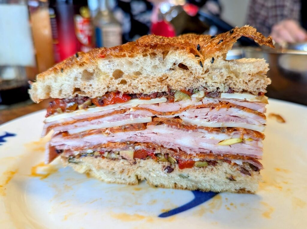 Made Kenji's muffuletta by pressing it with his books!