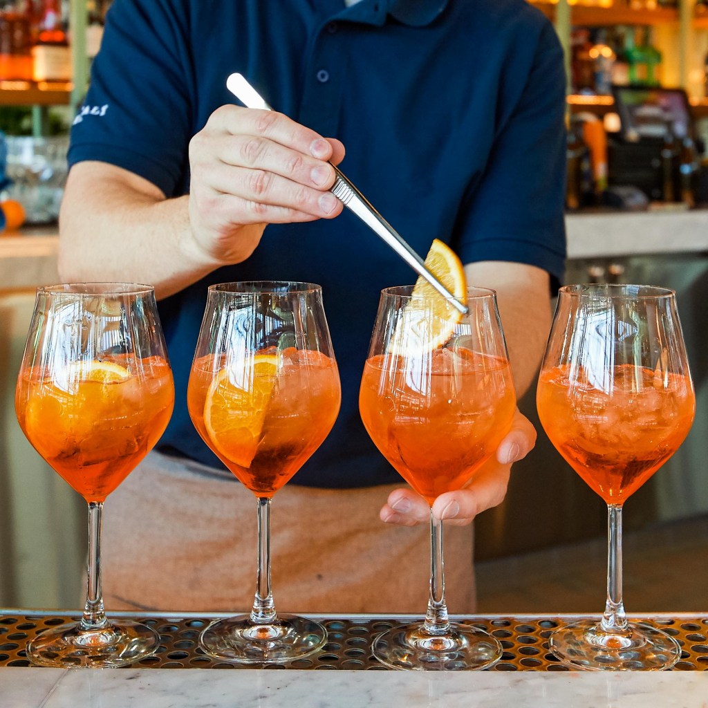 aperol spritz lined up at the bar at Eataly Las Vegas 
