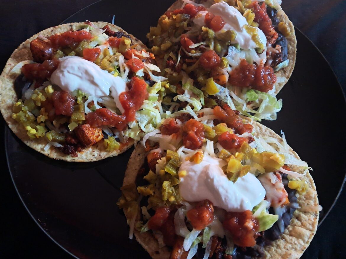 Watching stand up along with my tostada's. Chorizo, potatoes, refried black beans, and cheese. Salsa, chopped jalapenos, and lettuce added to the top.