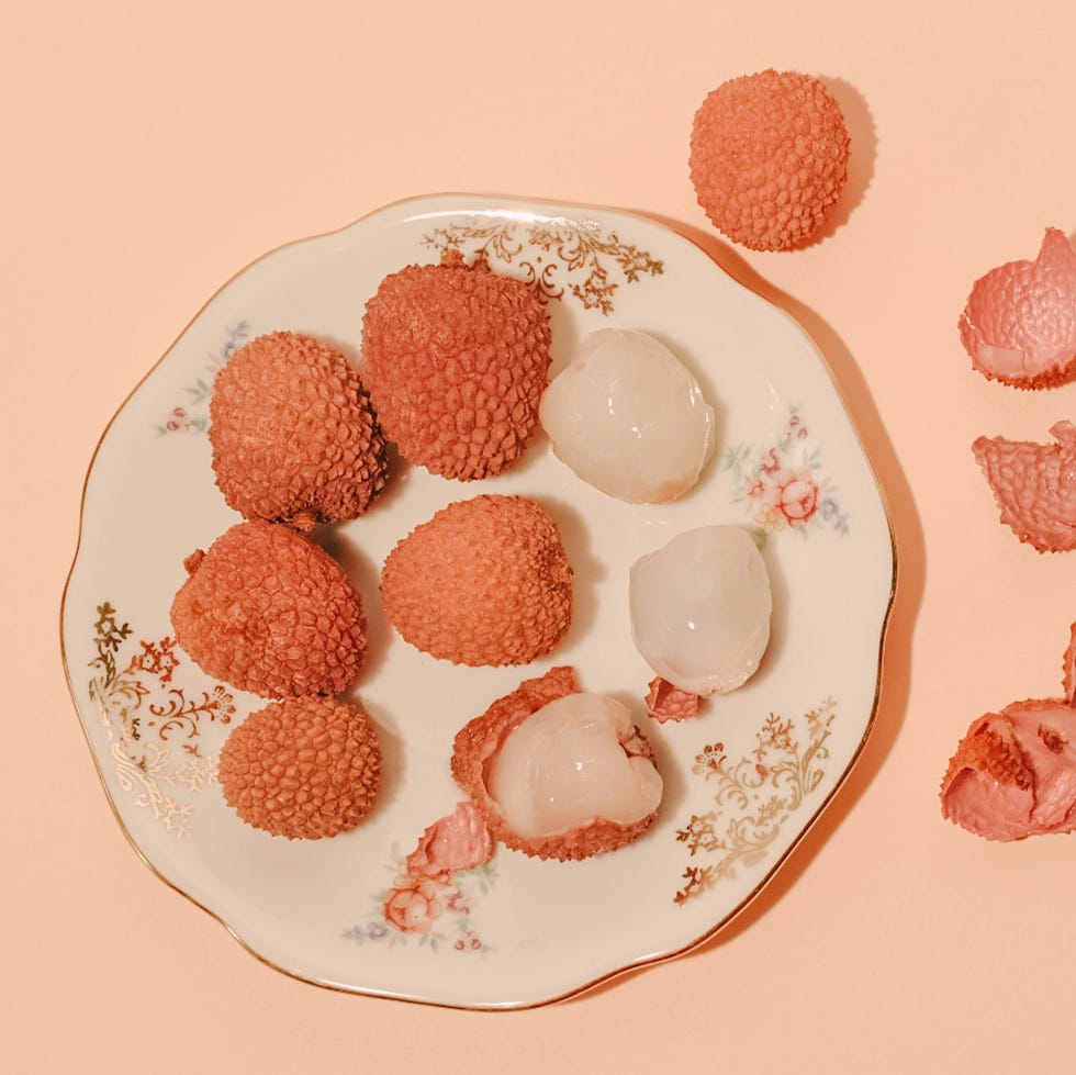 nine lychees on a plate