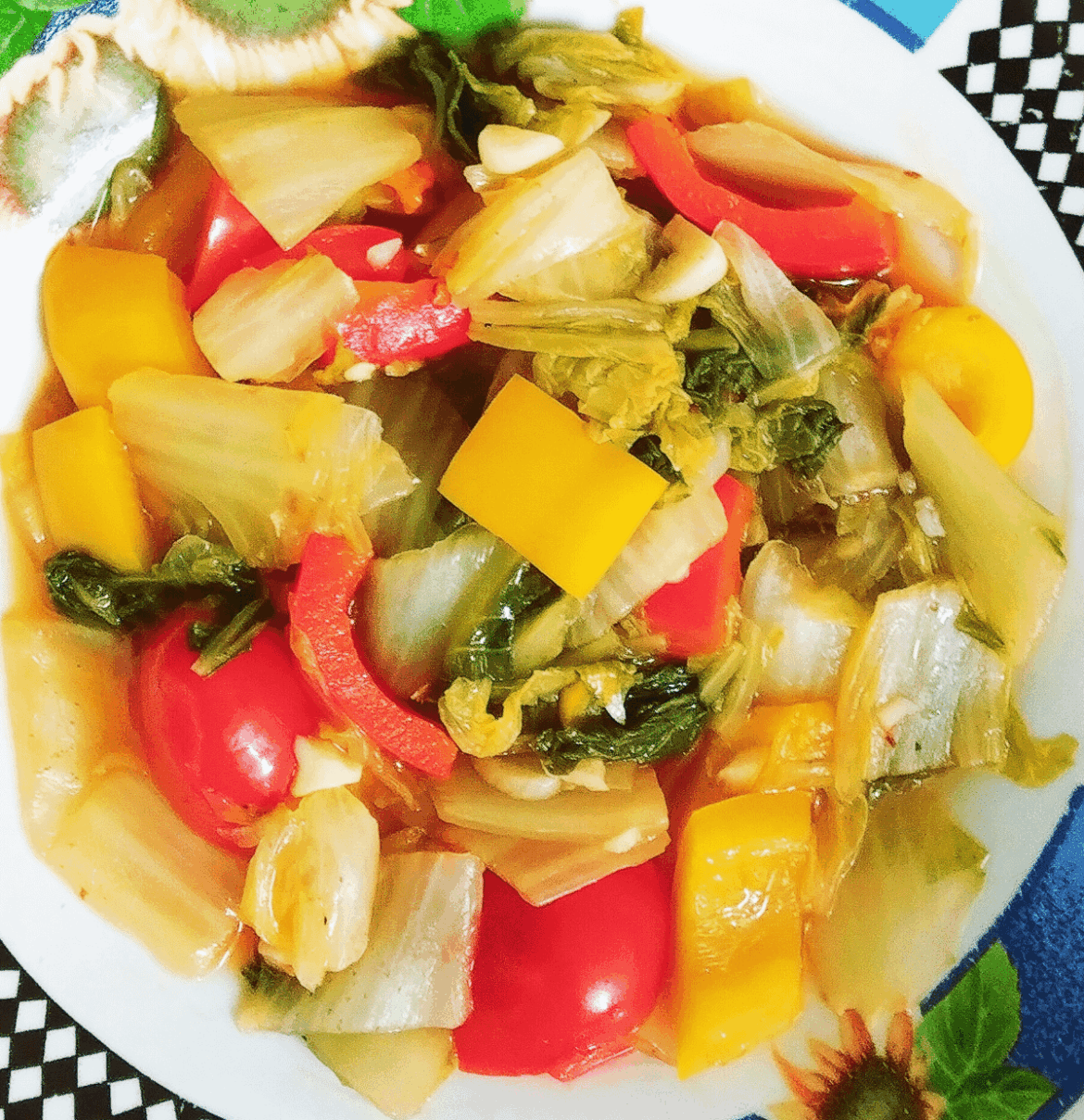 Cabbages, red and yellow bell peppers in sweet sauce