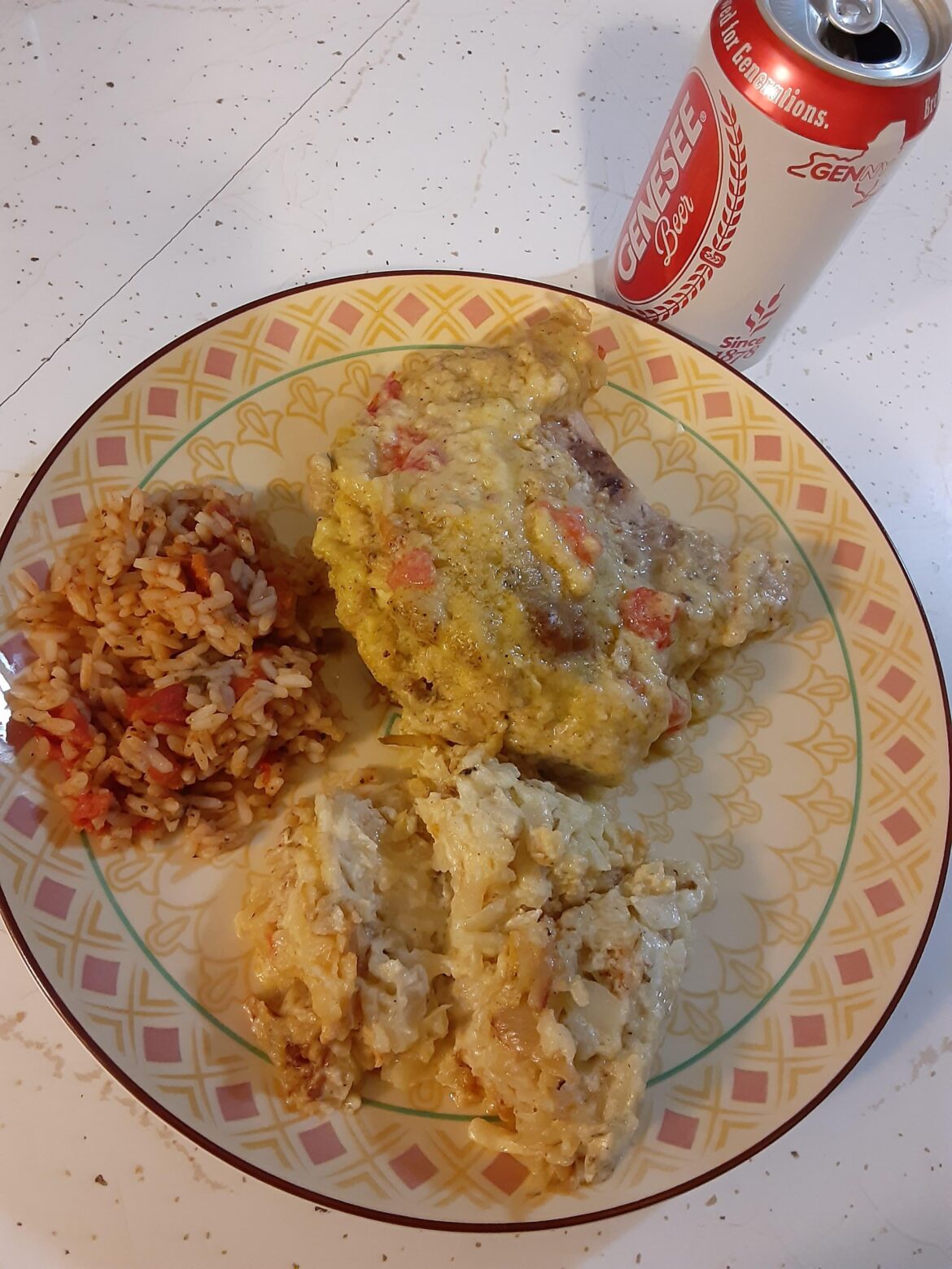 Stuffed porkchop, shredded cheesy potatoes and mexi rice