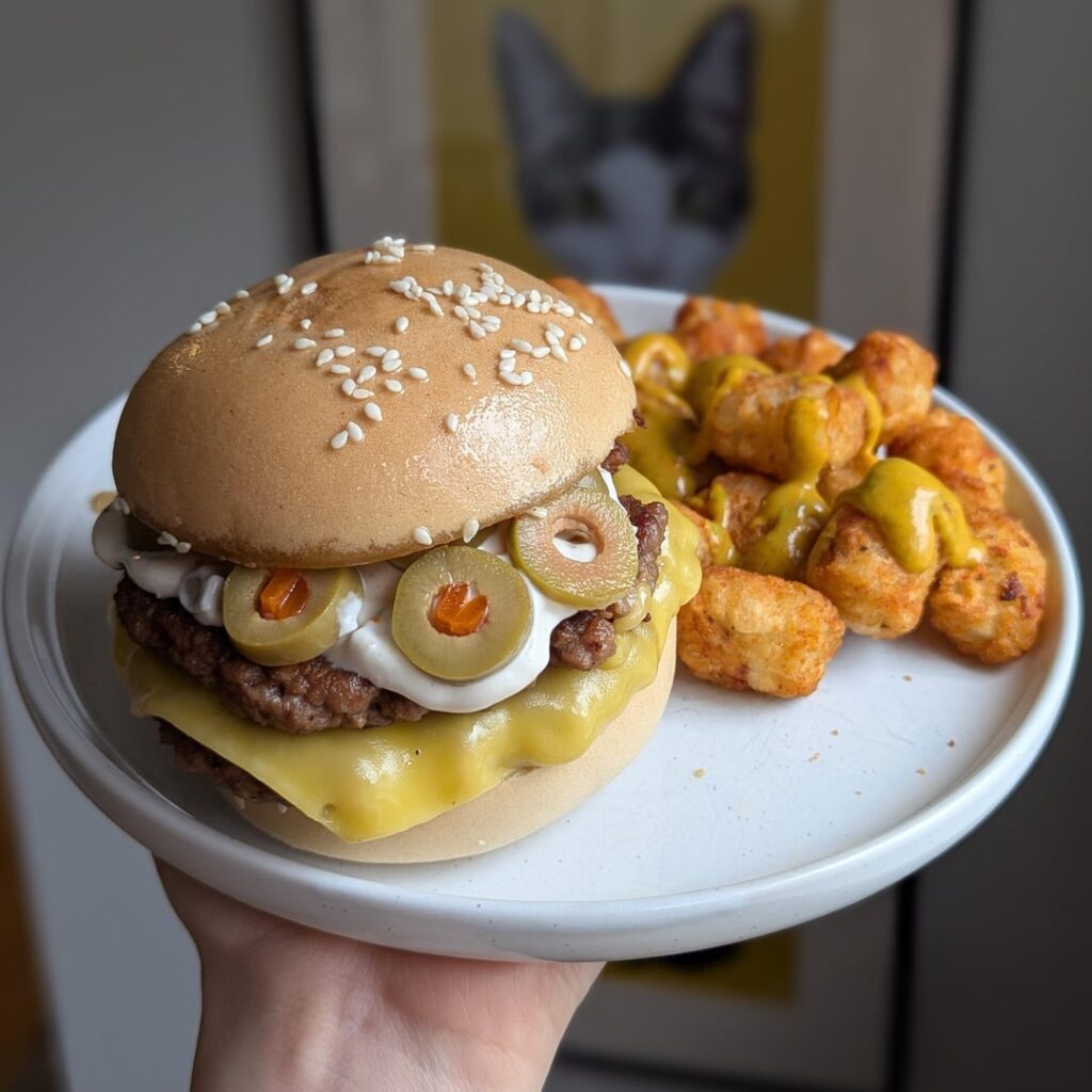double olive cheeseburger with tarragon maple mustard tots.