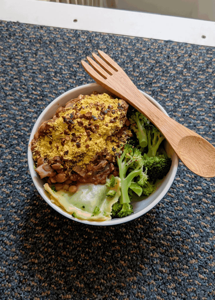 Lentil & mushroom pasta sauce with ravioli and broccoli