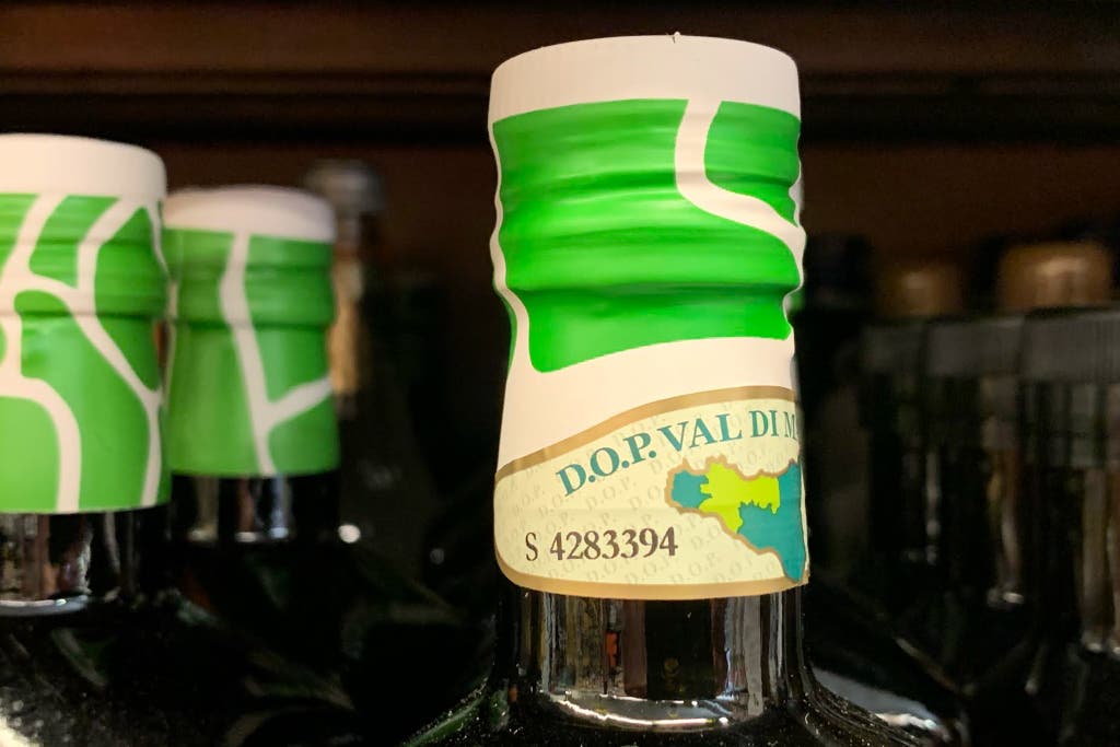 The cap of a bottle of olive oil.