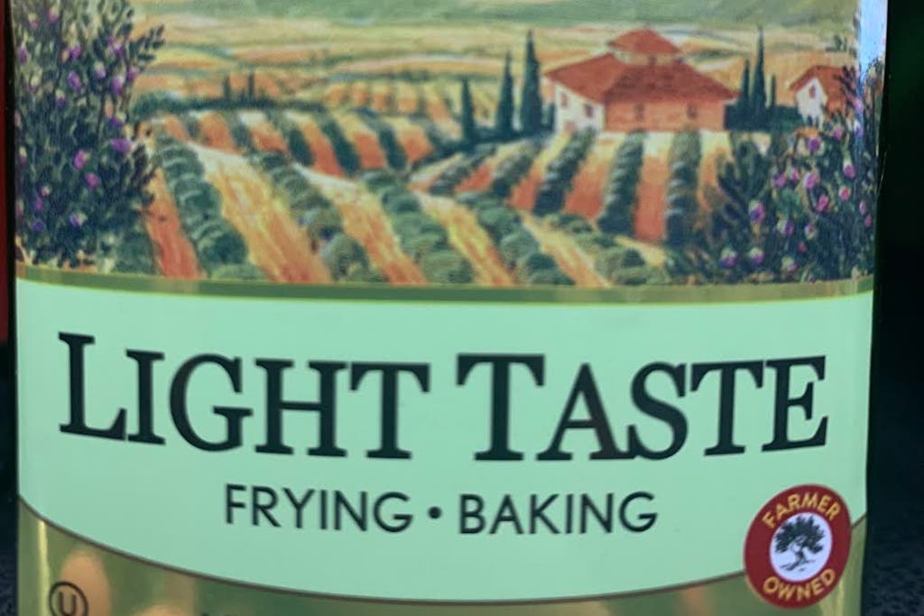 A close-up of a light taste olive oil bottle.
