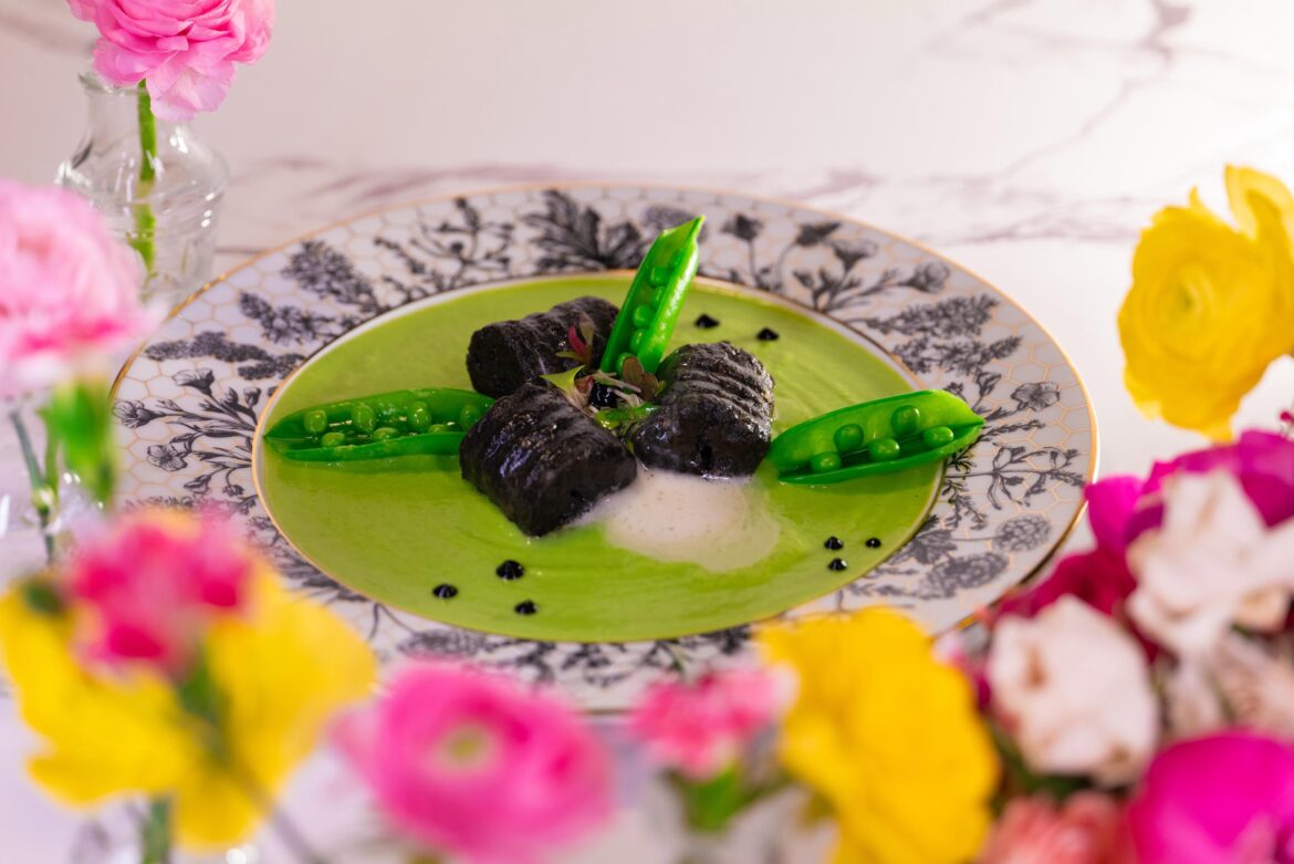 Charcoal-leek ash gnocchi, sweet pea purée, lemon espuma, black garlic gel, snap peas