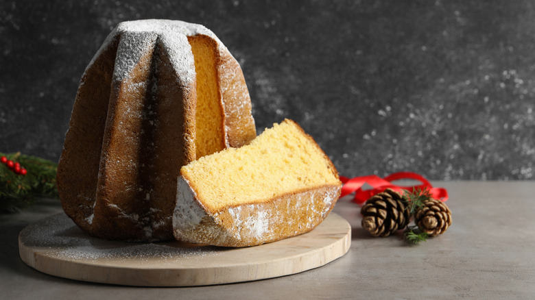 A pandoro cake with a slice taken out of it