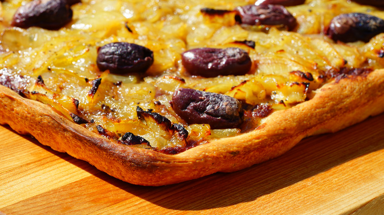 Corner of pissaladiere with olives