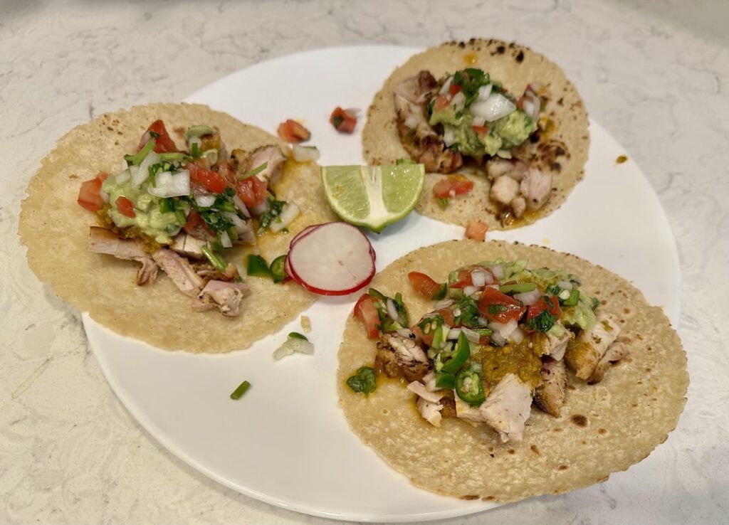 Pollo Asado tacos with roasted habanero salsa, guacamole, and pico de gallo