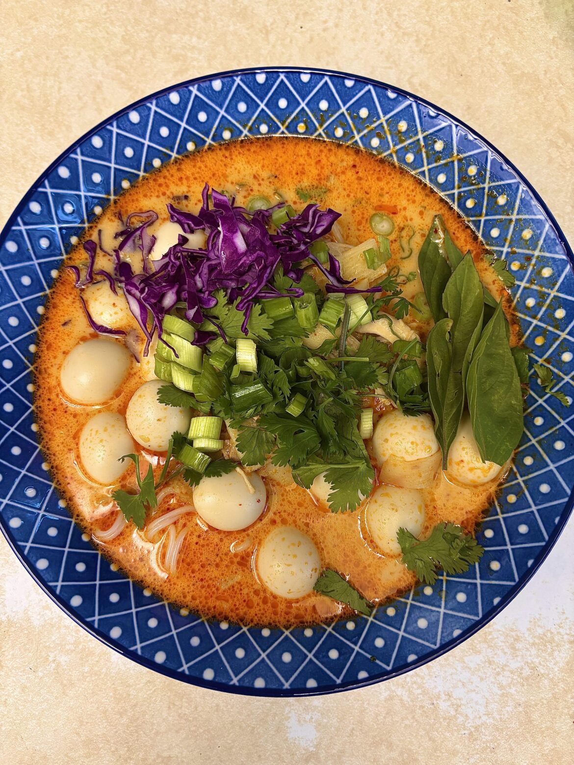 [OC] Homemade Khao Poon. A Lao coconut curry noodle soup with chicken, vermicelli noodles, bamboo shoots, and extra quail eggs.