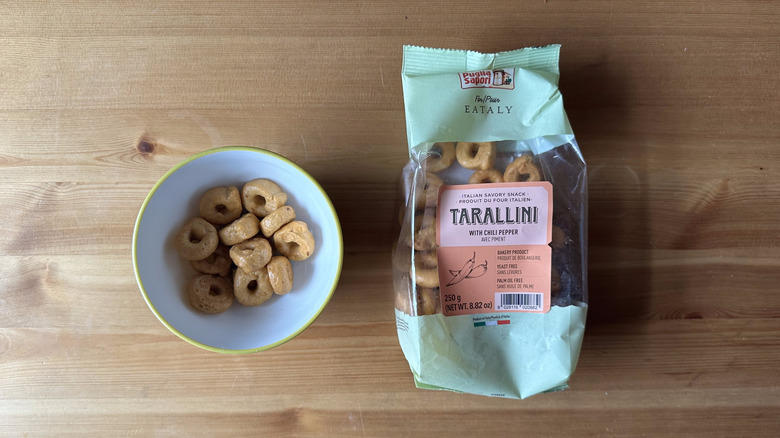 Puglia Sapori Tarallini with Chili Pepper on wooden table