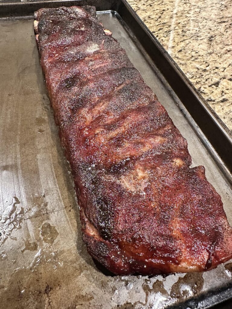 Mother’s Day smoke out. Tritip, ribs, candy bacon, maple brekky sausage - I use butter and hate the white patches it leaves but it’s so yum! 🙏