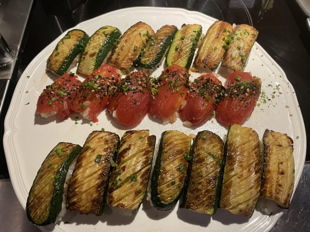 Made half veggie/half fish sushi for my wife's student workers. Zucchini nigiri, tomato nigiri, maguro nigiri and some spicy roll with the leftovers.