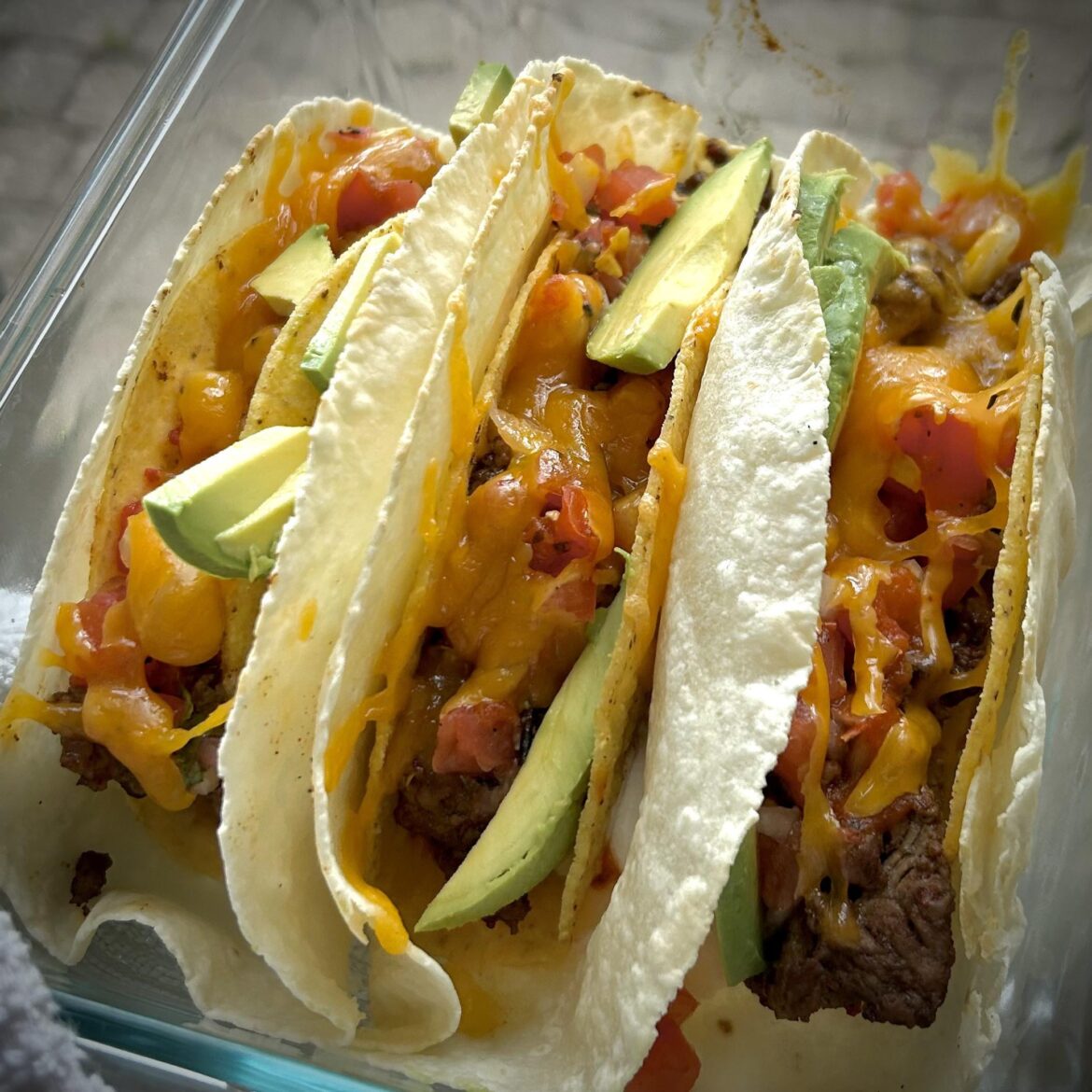 Simple steak tacos with salsa, avocado cheese and sour cream