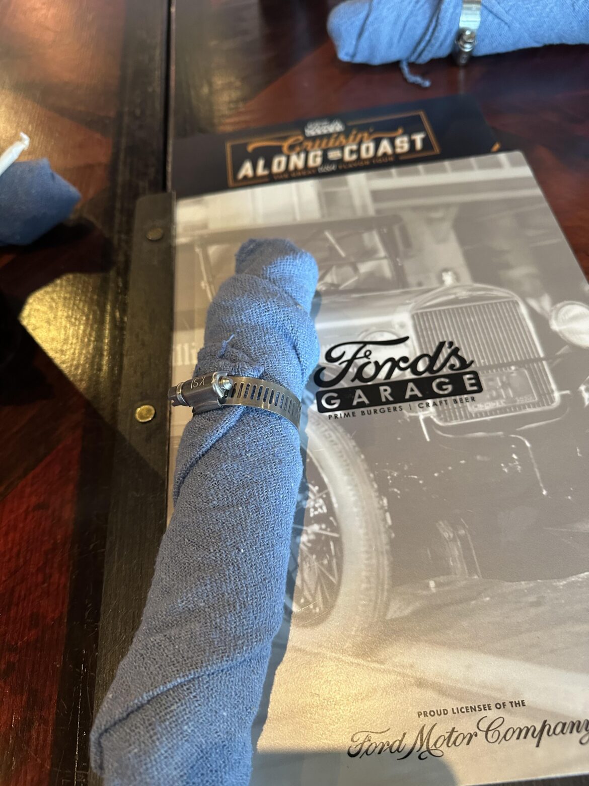 Idk if this belongs but my cutlery is served in a shop towel and a hose clamp…