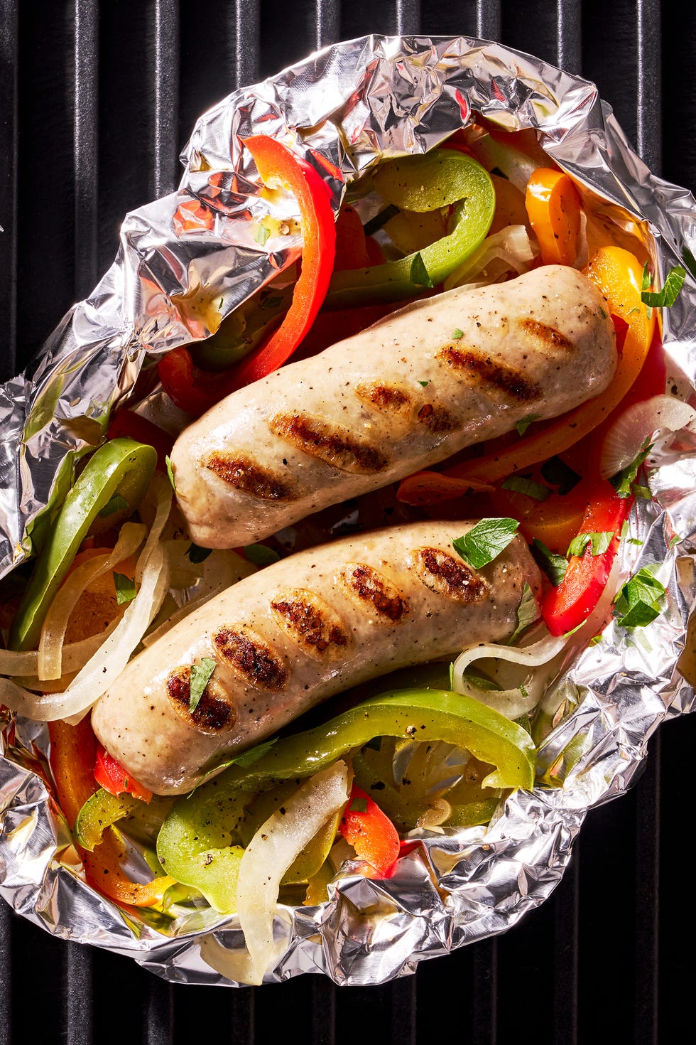 sausage and peppers in a foil pack on the grill