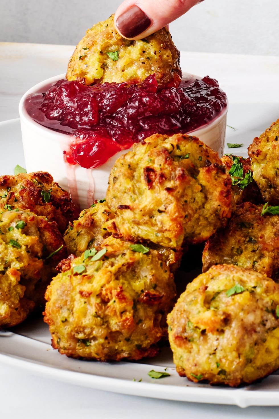 sausage stuffing bites with cranberry sauce