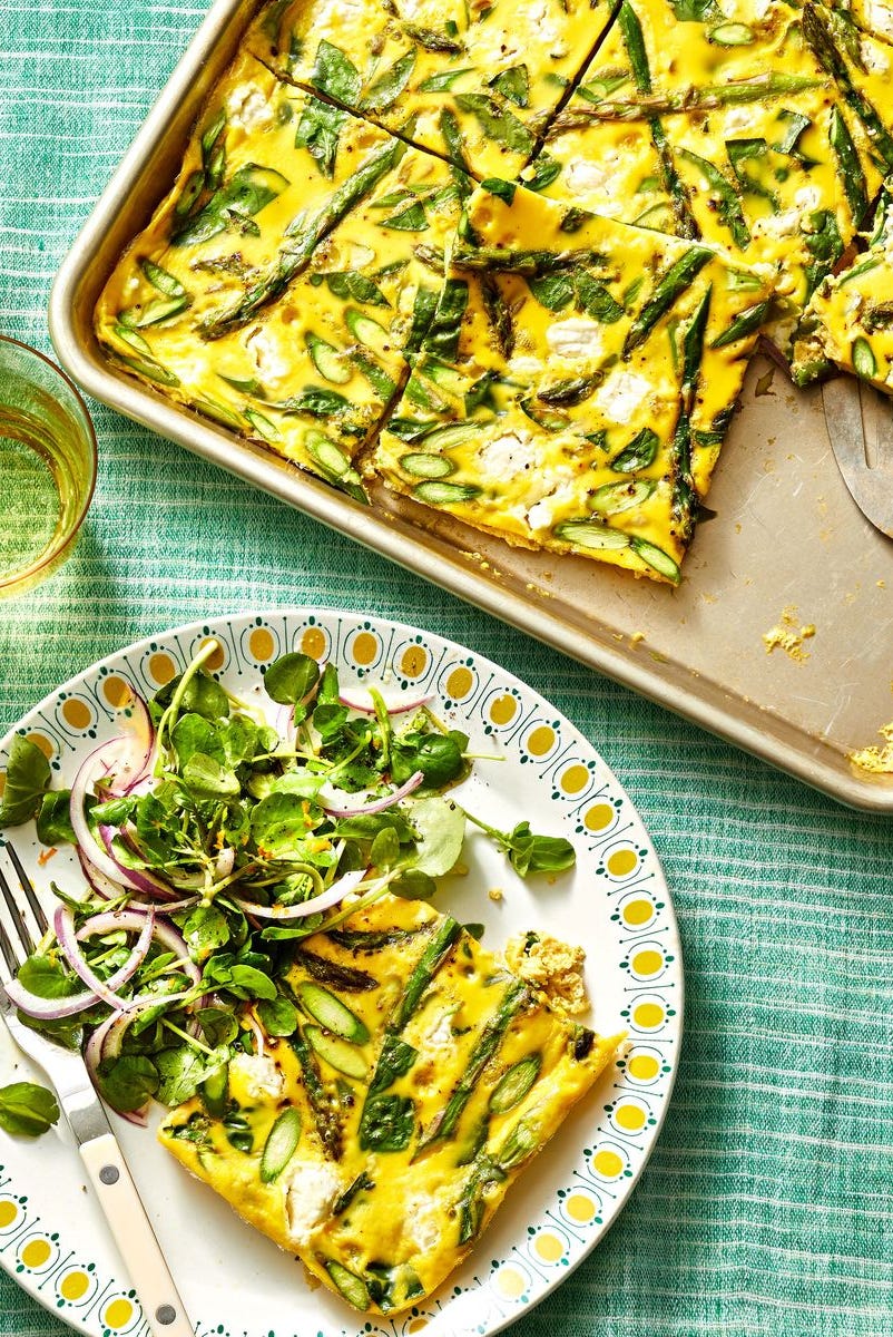 Sheet Pan Asparagus Frittata sheet pan asparagus frittata with a side salad on a plate