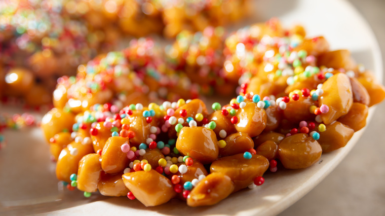 A struffoli wreath made with tiny dough balls