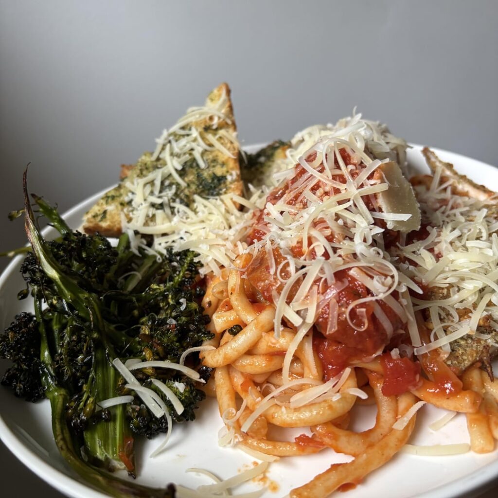 Classic Italian American Sunday, Marcella Hazan’s tomato sauce, fresh bucatini, mtblls,ssg&chx cutlets, w/ roasted broccolini & garlic bread & a snow storm of Parmesan