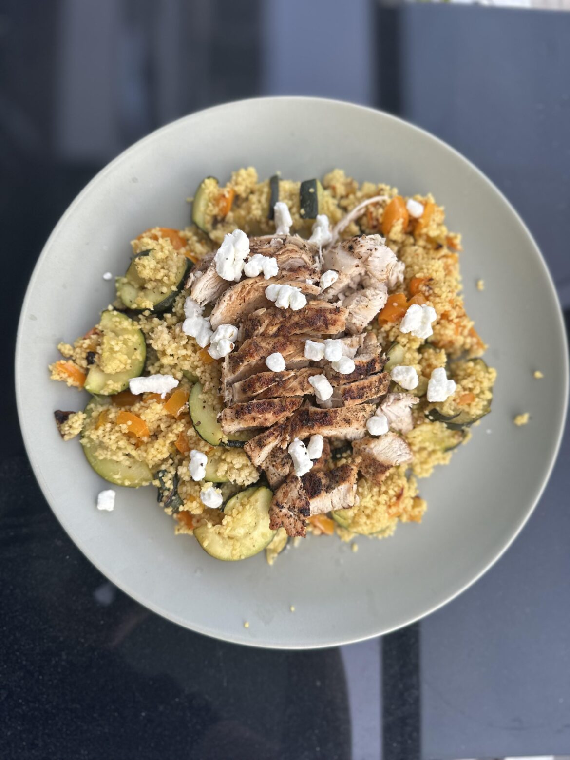 Greek style lemon chicken with roasted veggie couscous and crumbled goat cheese