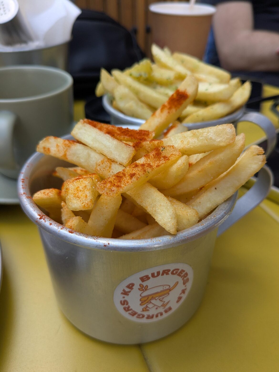 Fries in a metal cup