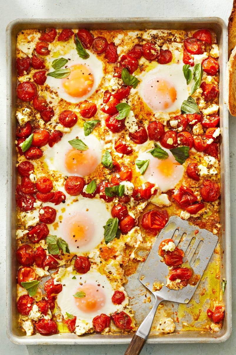 Tomato and Feta Baked Eggs tomato and feta baked eggs on a sheet pan