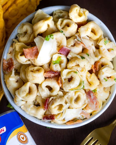 bacon tortellini carbonara in bowl with can of chicken broth