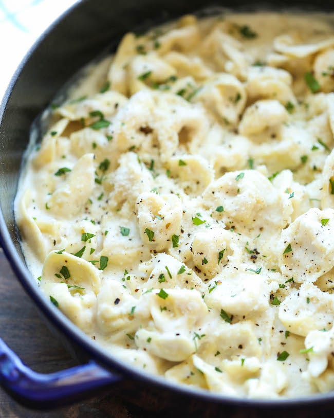 garlic alfredo tortellini in blue pot