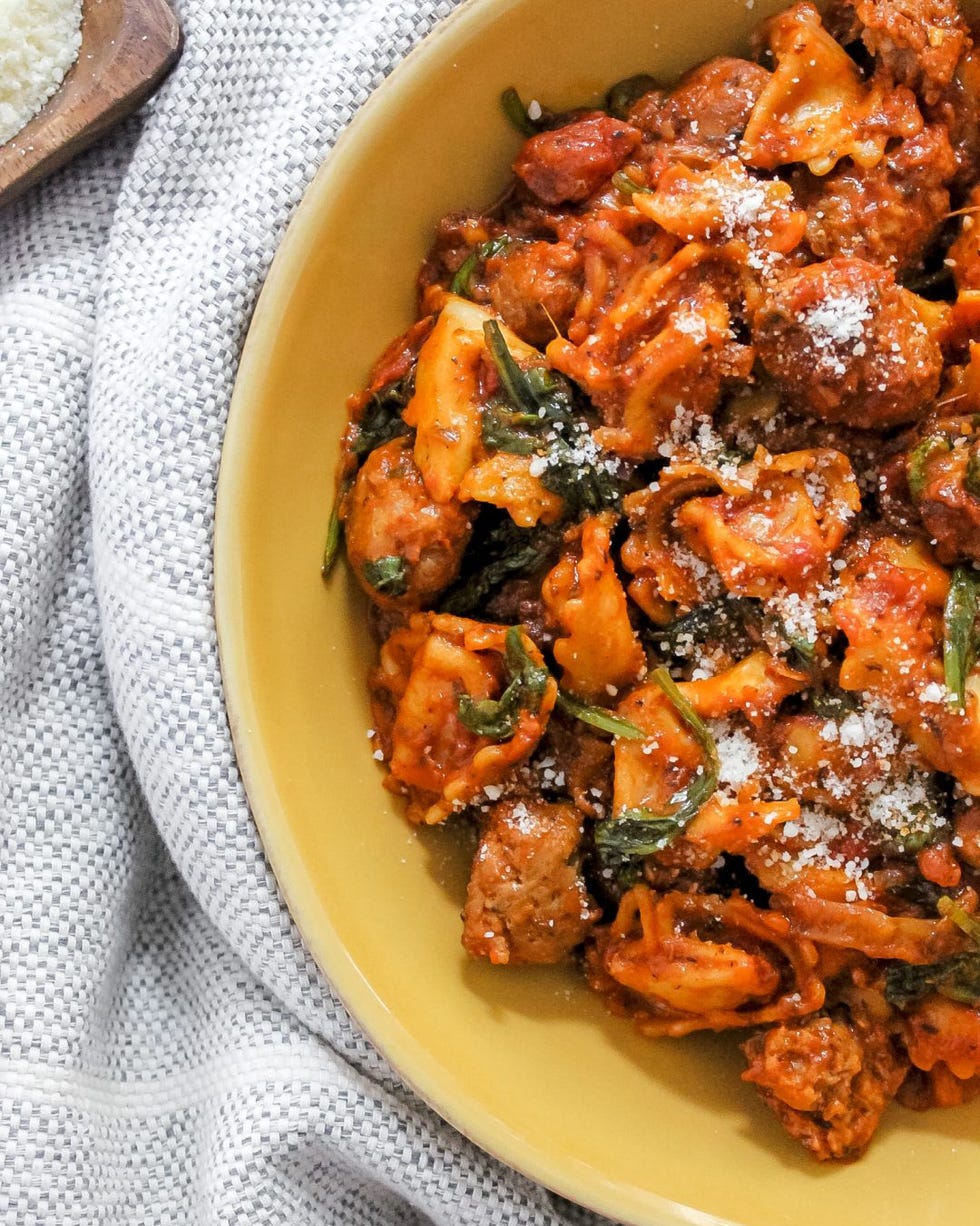 one pot italian sausage spinach and cheese tortellini in yellow bowl